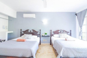 Habitación espaciosa con dos camas dobles